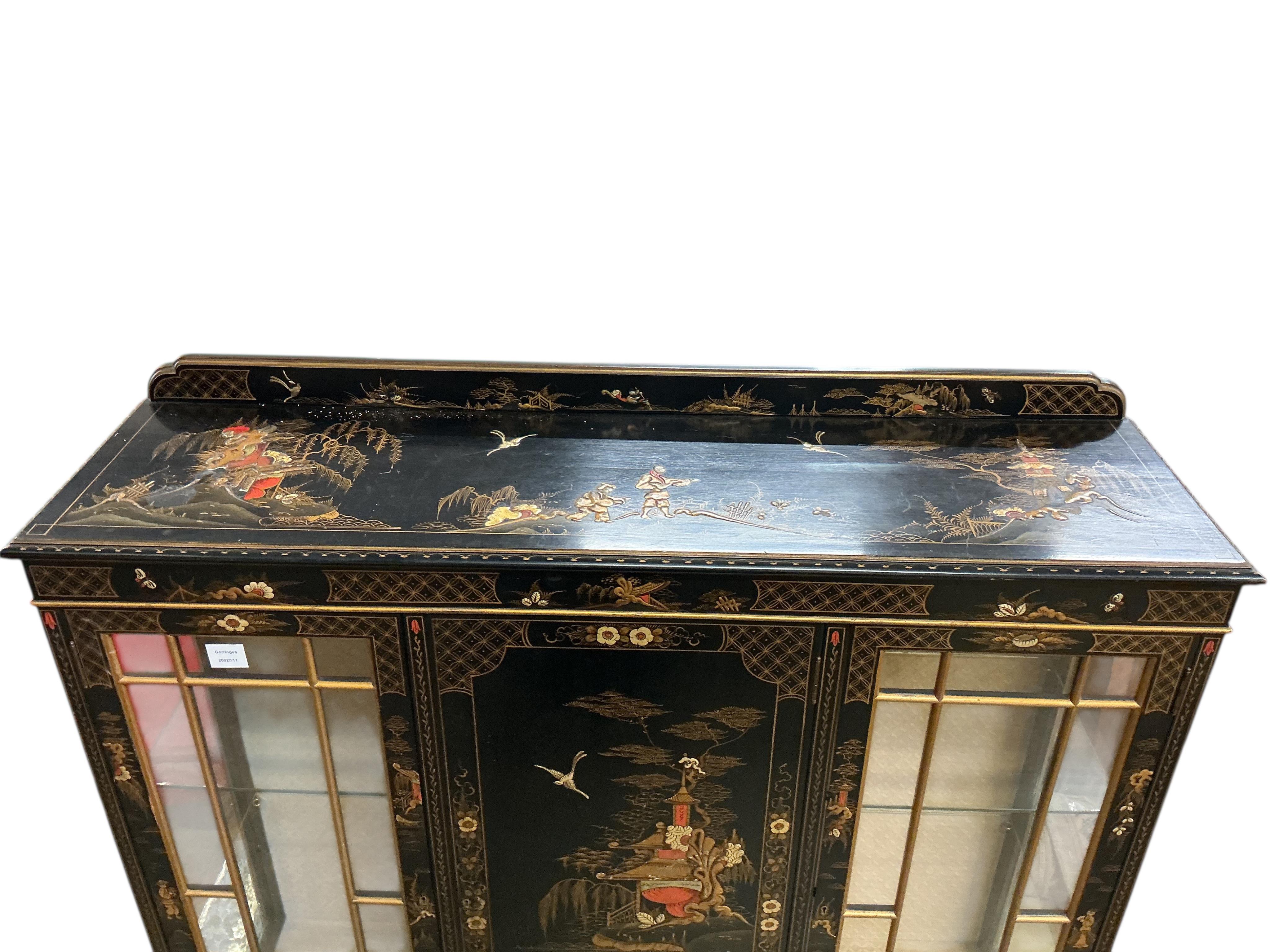An early 20th century chinoiserie lacquer display cabinet, width 124cm, depth 34cm, height 130cm